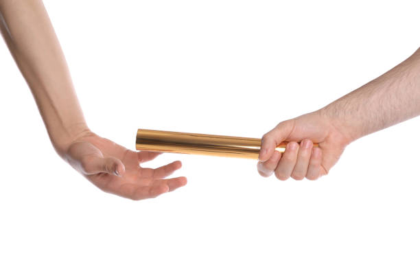istock Man passing relay baton to teammate isolated on white, closeup 1405396404