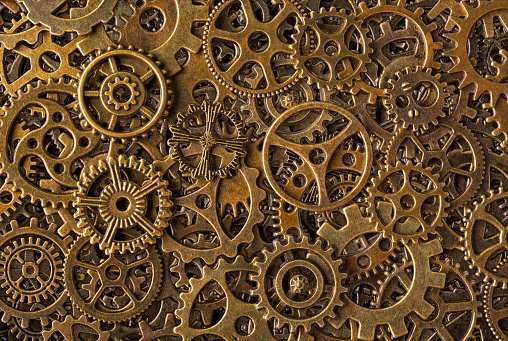 Big group of bronze cogwheels, abstract retro-style industrial steampunk background
