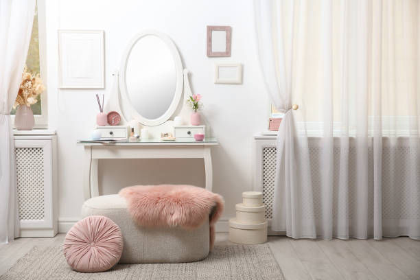 istock Dressing table with decor near white wall in room 1405397129