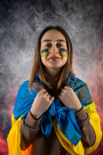 all the emotions of pain, sadness and fear on the face of a young Ukrainian woman. war of Russia all the emotions of pain, sadness and fear on the face of a young Ukrainian woman with a flag and hope for peace. war of Russia grimma stock pictures, royalty-free photos & images