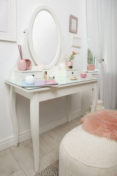 istock Dressing table with decor near white wall in room 1405397238