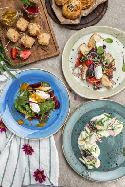 istock three different salads and fried cheese snack for the menu on the table 1405398843