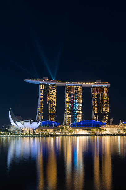Marina Bay Sands Hotel. Art and Science Museum and Helix Bridge in the evening, Marina Bay, Singapore