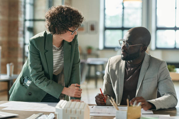 istock Couple of architects working in team 1405399227