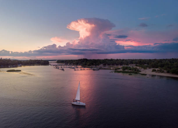 istock The white yacht and pink cloud with anvil shape 1405401032