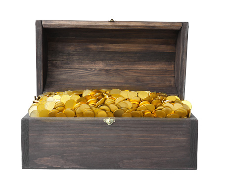 Isolated photo of opened treasure chest with coins on white background.