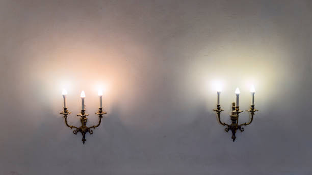 Vintage wall lamp. Space for text. Lamp light on the wall. Working lamps at dusk.