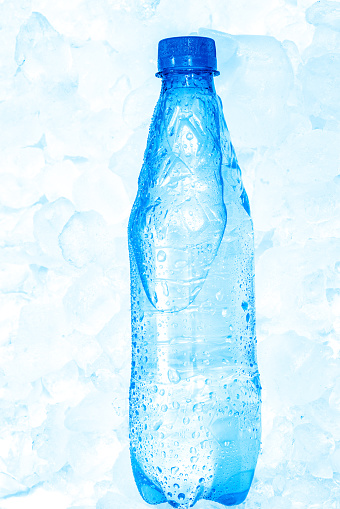 Water in plastic bottle in ice cubes