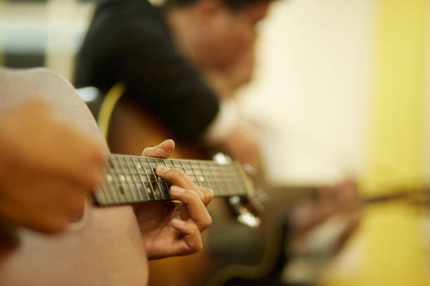 istock Selective focus of  hand playing the guitar 1405406988