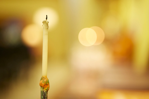 Candle stops burning, until the candle burns out in Buddhism temple background