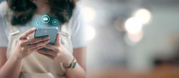 Young woman using smartphone with social media application display, lifestyle and leisure via cyberspace technology