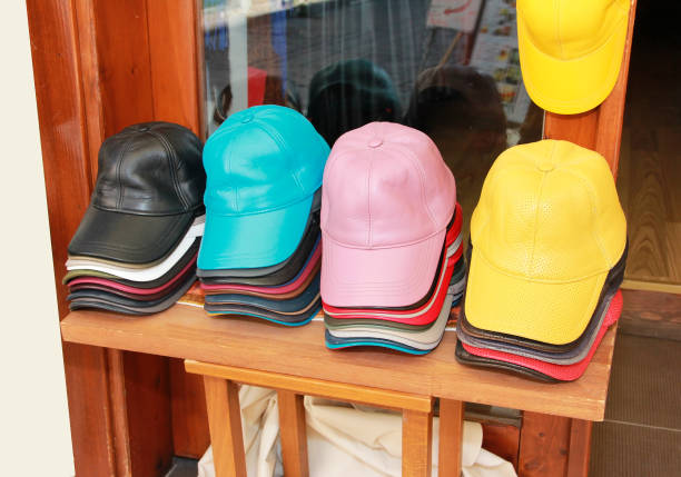 istock multicolored baseball caps on the shop window 1405410293