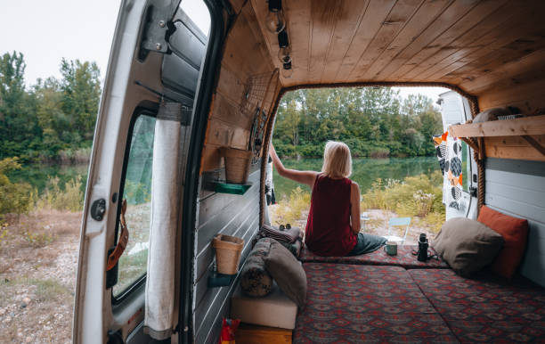 istock Woman enjoys coffee from her van 1405413579