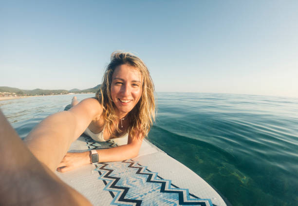 istock Woman taking selfie on paddle board 1405414080