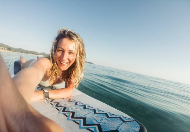 istock Woman taking selfie on paddle board 1405414098