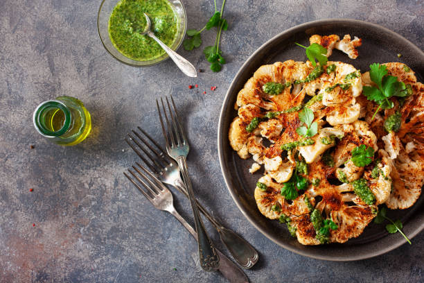 istock cauliflower steaks with herb sauce and spice. plant based meat substitute 1405415328