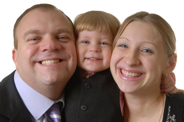 Happy  family portrait: dad, mom and cute son