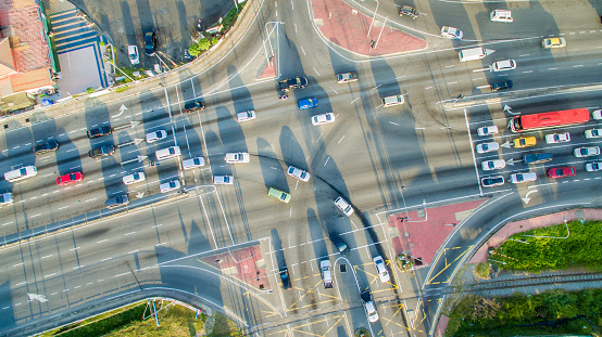 Transportation cross the traffic light junction at Putatan town, Sabah Borneo. Aerial view