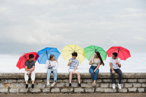 istock Group of friends chatting in a rainy day 1405419920