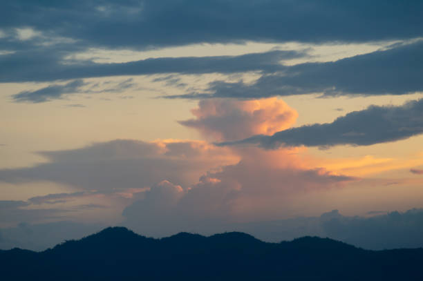 Backgrounds of colourful and beautiful sunset / sunrise with clouds with sunlight on dramatic sky texture