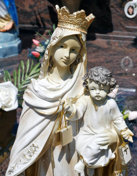 istock Figurines on a tombstone in the public cemetery 1405420662
