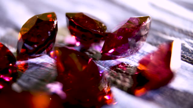 Close-up. Polished gemstone ruby bright red color. Exquisite gemstone ruby