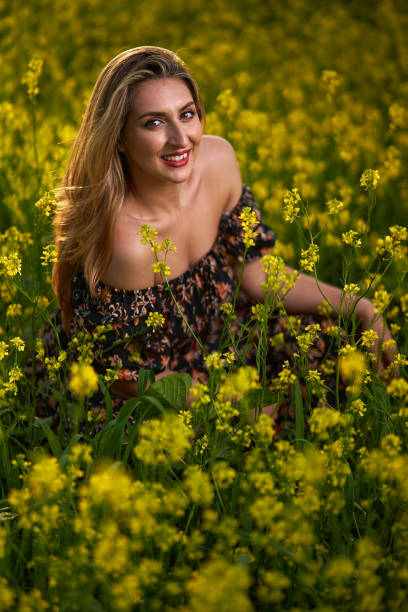 istock Plus size indian woman in a field at sunset 1405433420