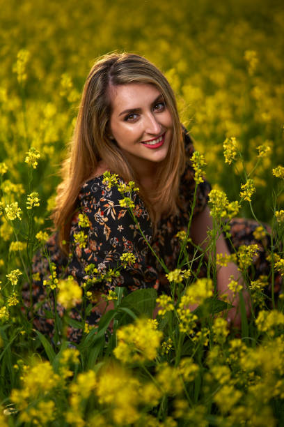 istock Plus size indian woman in a field at sunset 1405433427