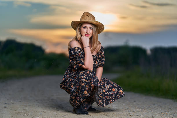 istock Pretty plus size farmer lady at sunset 1405433438