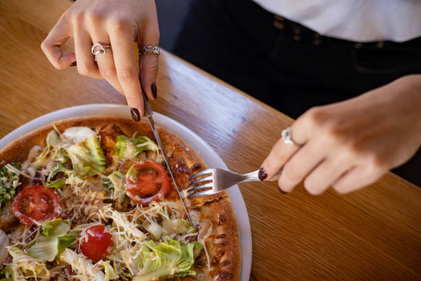 istock Italian pizza on a wooden table in a restaurant 1405434517