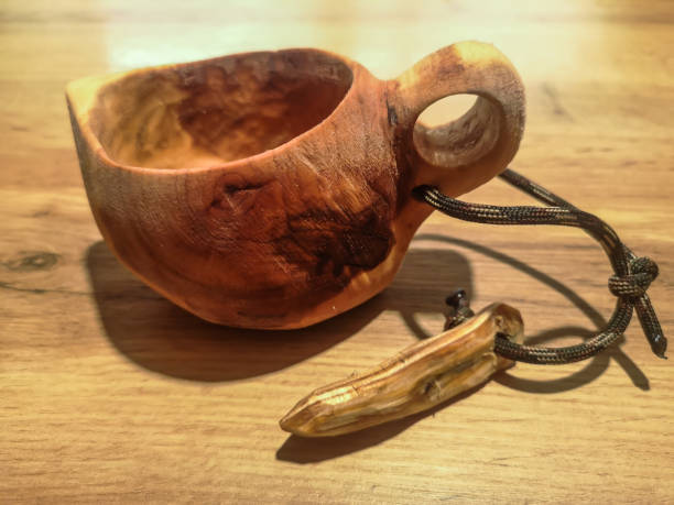 istock carved wooden cup from a birch on a table 1405434742