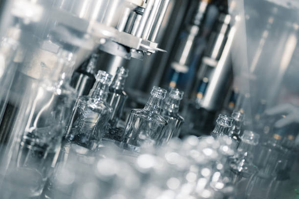 istock Automatic production line fills glass bottles with vodka 1405436707
