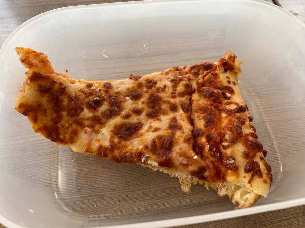 istock a slice of pizza in a plastic container 1405437429
