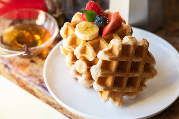 istock Belgian waffles, berries with honey and coffee. Breakfast concept. 1405437461