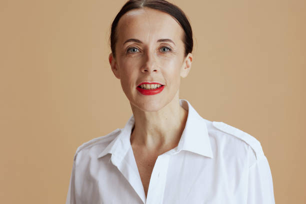 istock modern female in white shirt against beige background 1405439667