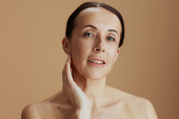 istock modern woman posing isolated on beige 1405439669