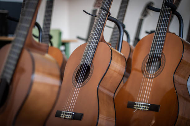 istock Several Spanish guitars, in a course to learn to play the Spanish guitar 1405440271