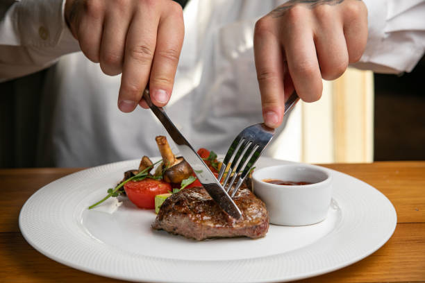 istock Steak with garnish and sauce on a plate 1405440311