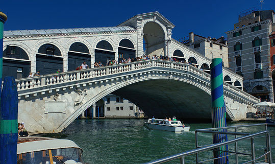 Venice, Italy - September 04, 2018: The Rialto Bridge, an important symbols of city. It connects the San Marco with the commercial zone. it was originally wooden and was build by Antonio Da Ponte