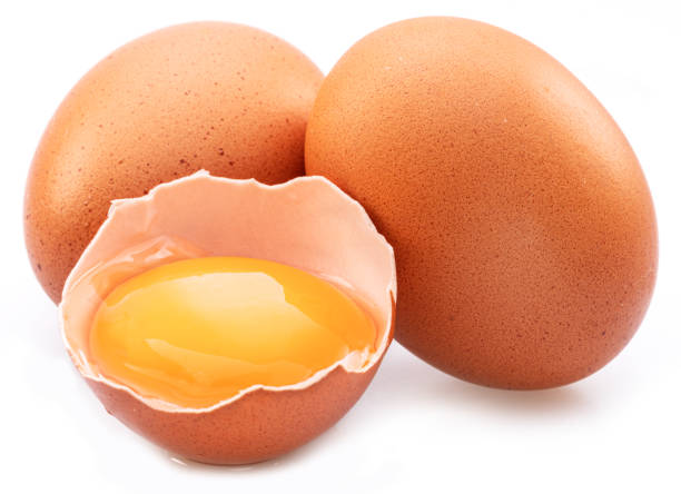 istock Brown chicken eggs and egg yolk isolated on white background. 1405442218