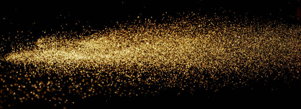 istock Golden glitter lights at black background. 1405442219