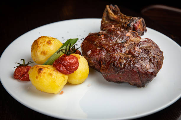 istock steak with  potatoes and cherries 1405443101