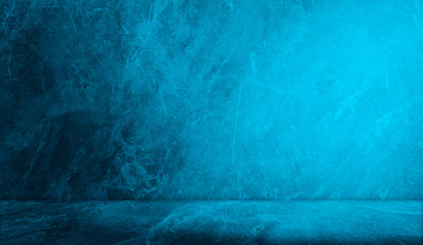 istock unobtrusive blue travertine marble background with shadow on the wall - trend frame, cover, card, postcard. exhibition podium, stand, on pastel light аrchitectural background for product displayed. 1405443379
