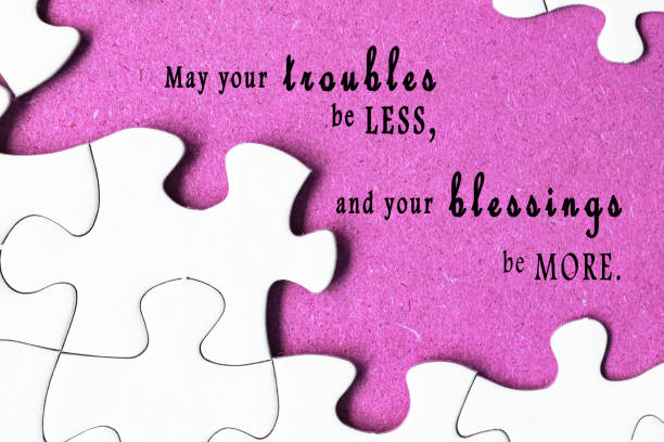 istock Motivational quote on white jigsaw with missing pieces on purple background. 1405444780