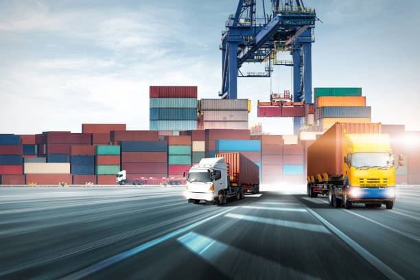 istock Container Truck on highway at ship port blue sky background with cargo container box loading by crane, global business logistics import export goods of freight carrier, transportation industry concept 1405444923