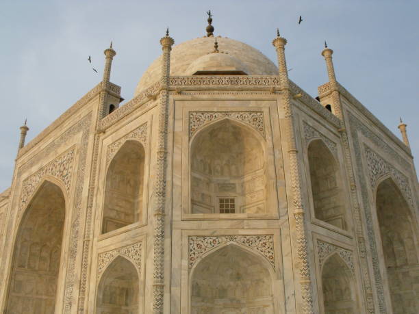 Taj Mahal, Agra, India, August 18, 2011: Side view of one of the richly decorated facades of the Taj Mahal white marble mausoleum