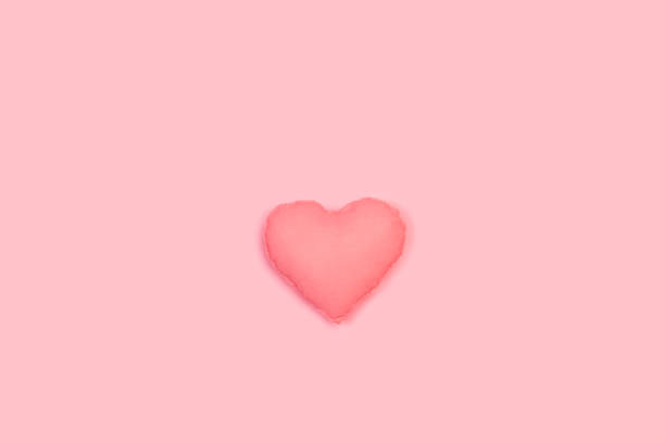 istock A fabric pink heart on a pink background 1405445239