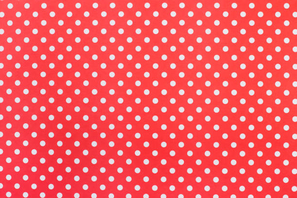 istock A red paper background with white polka dots 1405445309
