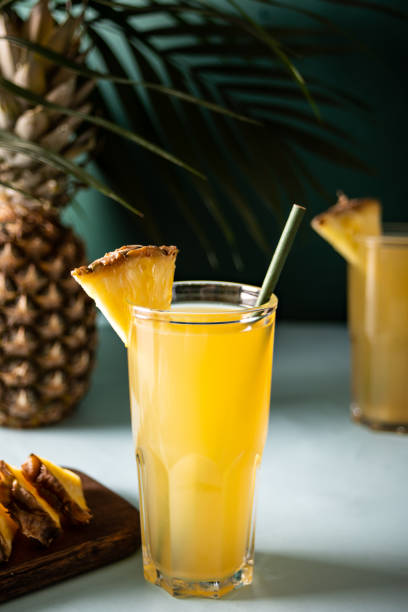 Summer refreshing tropical drink juice or cocktail with pineapple juice and tequila. stock photo