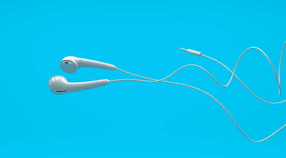 Close up flying white earphone mock up, 3d rendering, isolated on blue background.